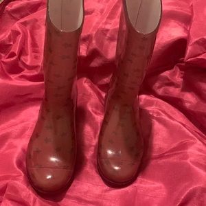 Pink UGGS rain boots.